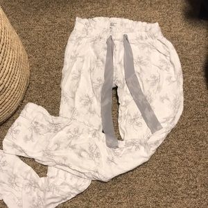 White pajama pants with grey flower silhouettes
